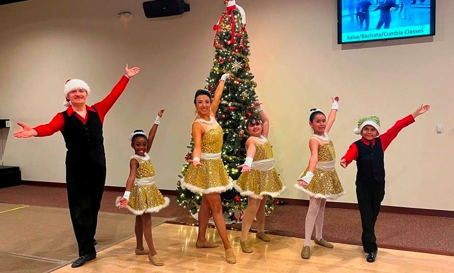 Child DanceSport class at Holiday Dance Showcase in Houston with their teachers Denis and Jeanette